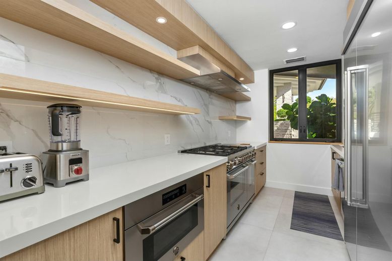Interior, Kitchen, Marble Walls, Recessed Lighting, Stainless Steel Appliances
