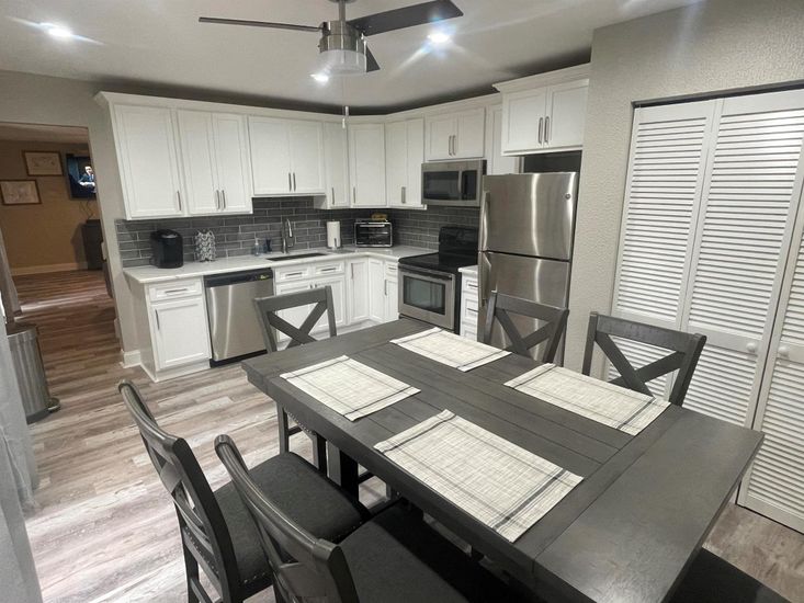 Dining room, Interior, Kitchen, Recessed Lighting, Stainless Steel Appliances, Wood Texture Flooring