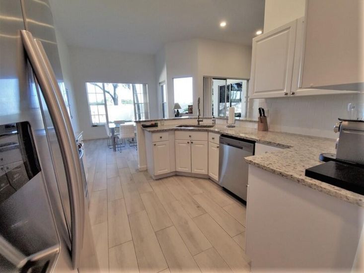 Dining room, Interior, Kitchen, Recessed Lighting, Stainless Steel Appliances, Wood Texture Flooring