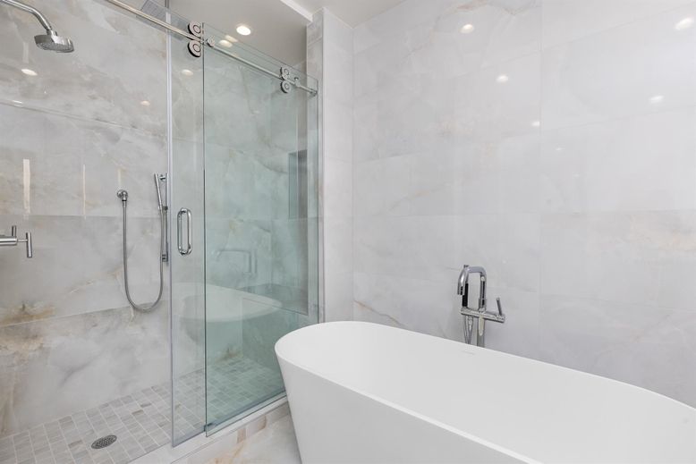 Bathroom, Free Standing Baths, Glass Shower, Interior, Marble Walls, Recessed Lighting