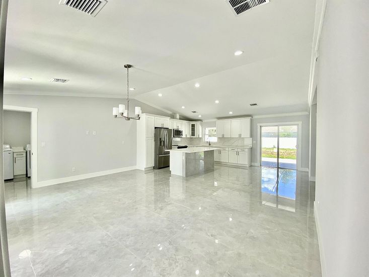 Chandelier, Empty room, Interior, Kitchen, Pendant Lights, Recessed Lighting, Stainless Steel Appliances