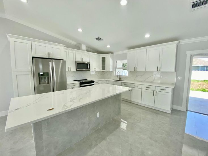 Interior, Kitchen, Marble Walls, Recessed Lighting, Stainless Steel Appliances