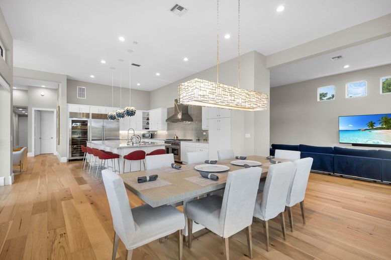Chandelier, Dining room, Interior, Kitchen, Pendant Lights, Recessed Lighting, Stainless Steel Appliances, Wood Texture Flooring