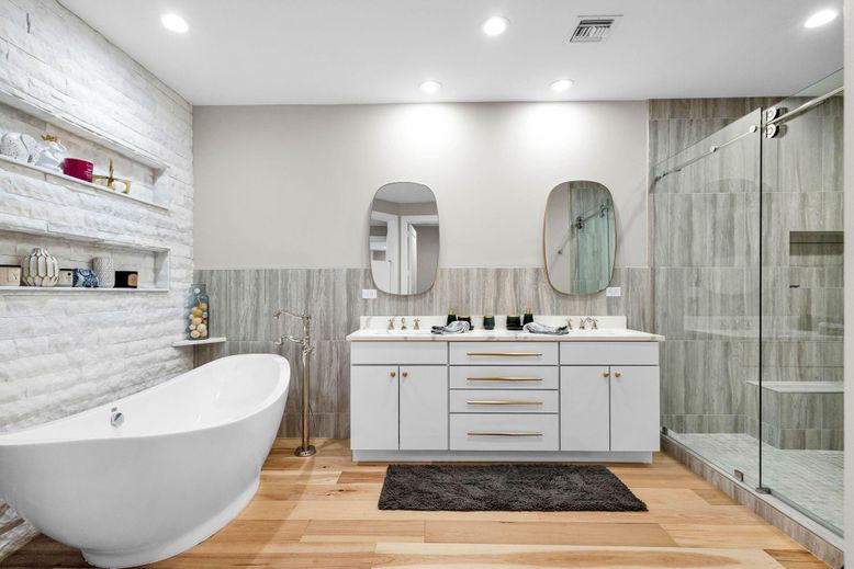 Bathroom, Dual Sink Vanities, Free Standing Baths, Glass Shower, Interior, Recessed Lighting, Wood Texture Flooring