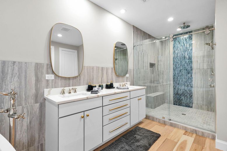 Bathroom, Dual Sink Vanities, Glass Shower, Interior, Recessed Lighting, Wood Texture Flooring