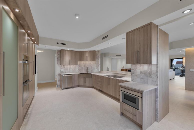 Interior, Kitchen, Marble Walls, Recessed Lighting, Stainless Steel Appliances