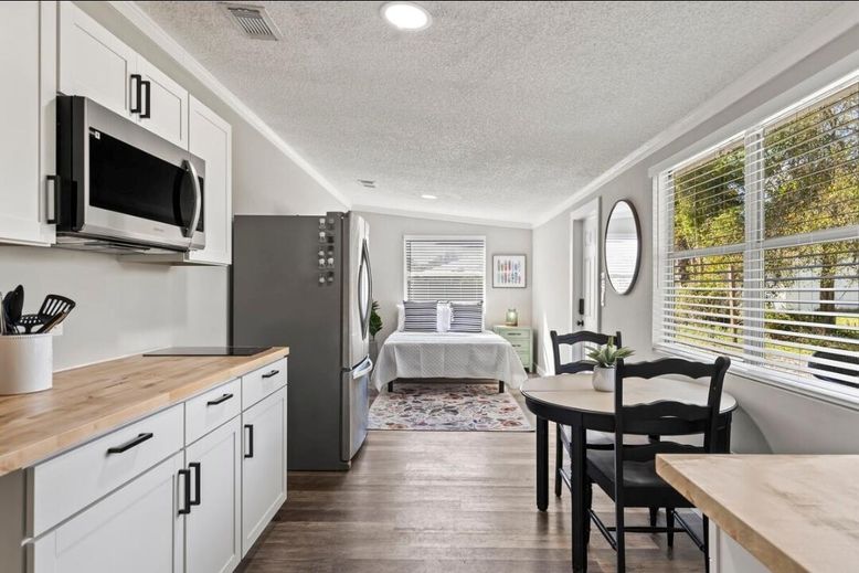 Bedroom, Dining room, Interior, Recessed Lighting, Stainless Steel Appliances, Wood Texture Flooring