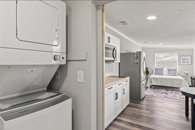 Bedroom, Interior, Recessed Lighting, Utility Closets, Washer, Wood Texture Flooring