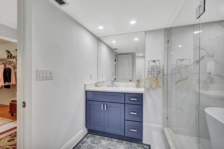 Bathroom, Dual Sink Vanities, Glass Shower, Interior, Marble Walls, Recessed Lighting