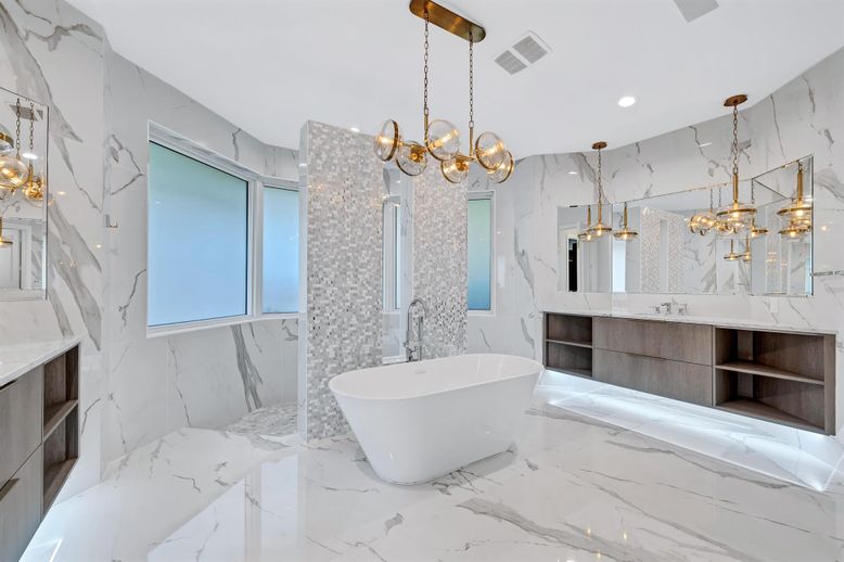 Bathroom, Chandelier, Dual Sink Vanities, Free Standing Baths, Interior, Marble, Marble Walls, Pendant Lights, Recessed Lighting