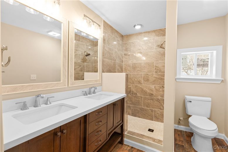 Bathroom, Dual Sink Vanities, Glass Shower, Interior, Recessed Lighting, Wood Texture Flooring