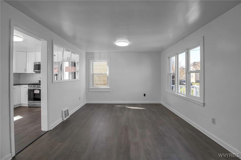 Empty room, Interior, Kitchen, Stainless Steel Appliances, Wood Texture Flooring