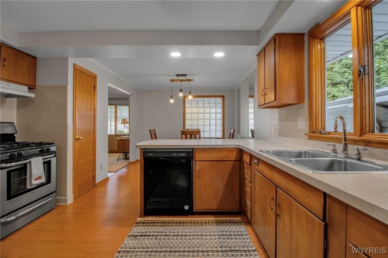 Dining room, Interior, Kitchen, Pendant Lights, Recessed Lighting, Stainless Steel Appliances, Wood Texture Flooring