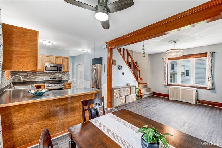 Chandelier, Dining room, Interior, Kitchen, Pendant Lights, Stainless Steel Appliances, Wood Texture Flooring