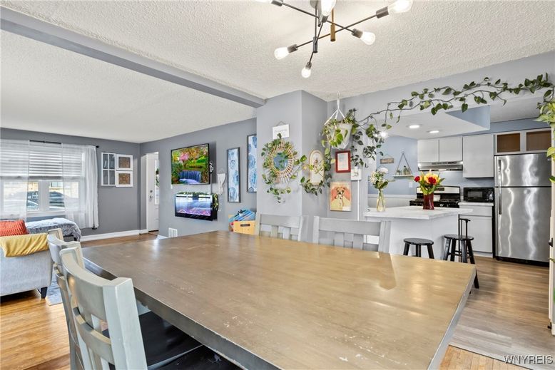 Dining room, Interior, Kitchen, Pendant Lights, Recessed Lighting, Stainless Steel Appliances, Wood Texture Flooring