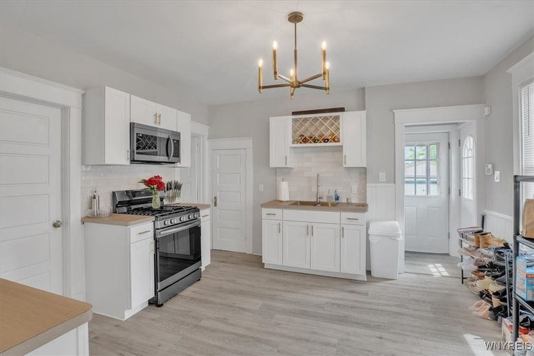 Chandelier, Interior, Kitchen, Pendant Lights, Stainless Steel Appliances, Wood Texture Flooring