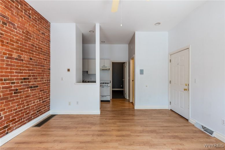 Empty room, Interior, Kitchen, Stainless Steel Appliances, Stone Walls, Wood Texture Flooring