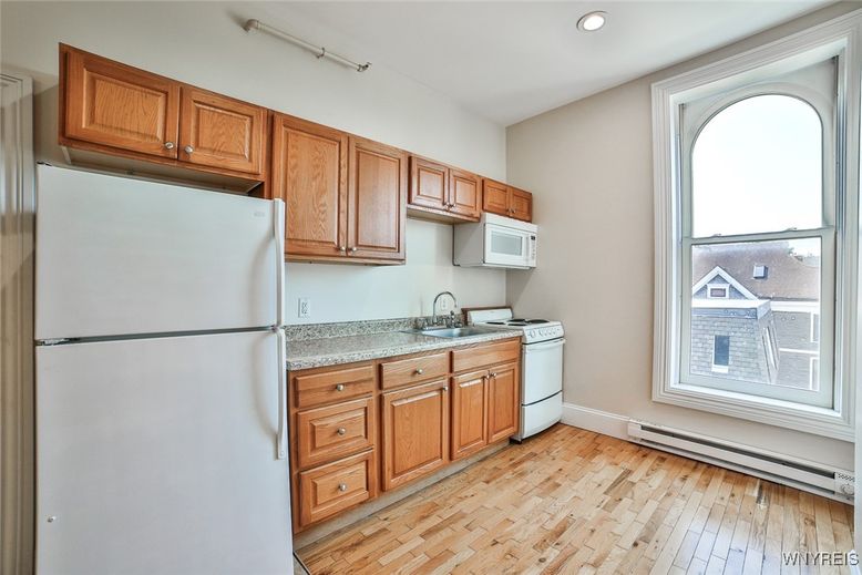 Interior, Kitchen, Recessed Lighting, Washer, Wood Texture Flooring