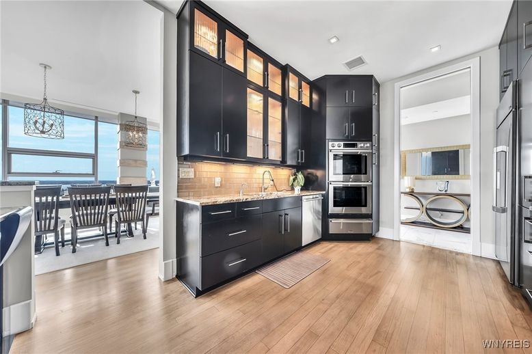 Dining room, Interior, Kitchen, Pendant Lights, Recessed Lighting, Stainless Steel Appliances, Water, Wood Texture Flooring