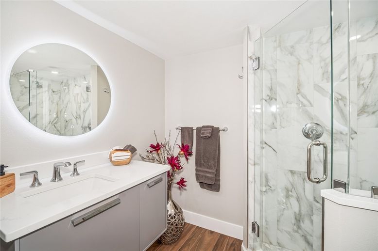 Bathroom, Glass Shower, Interior, Marble Walls, Wood Texture Flooring