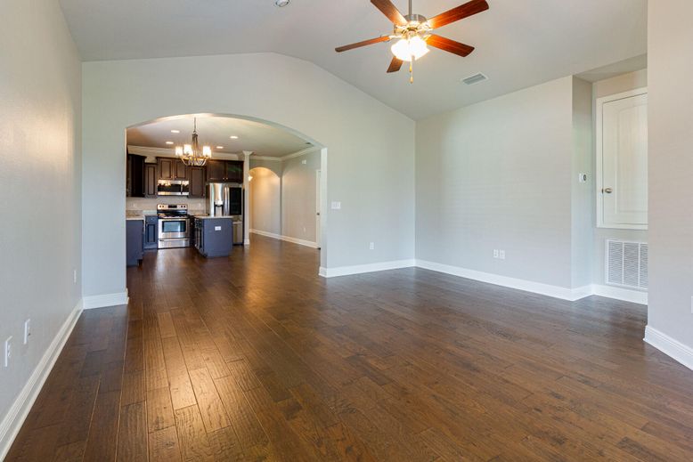 Chandelier, Empty room, Interior, Kitchen, Recessed Lighting, Stainless Steel Appliances, Wood Texture Flooring