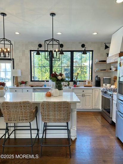 Chandelier, Dining room, Interior, Kitchen, Pendant Lights, Recessed Lighting, Stainless Steel Appliances, Wood Texture Flooring