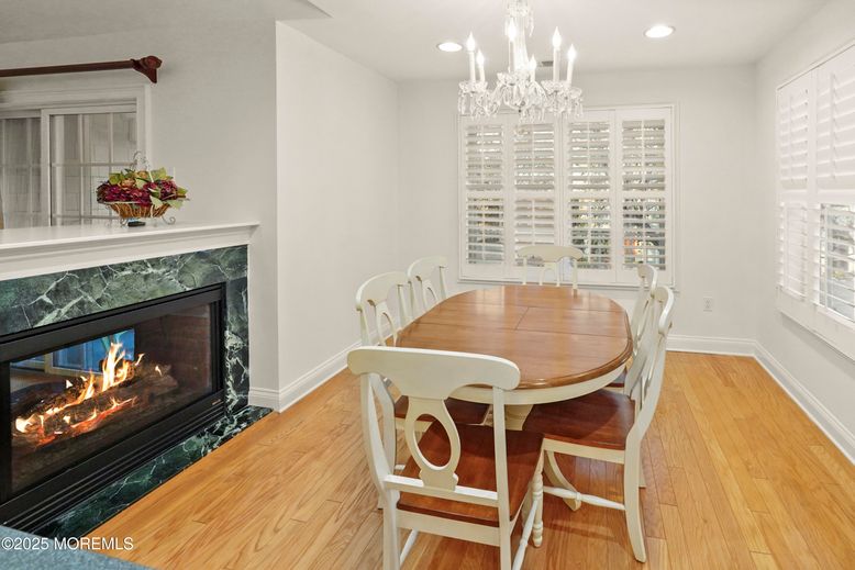 Chandelier, Dining room, Fireplace, Interior, Recessed Lighting, Wood Texture Flooring