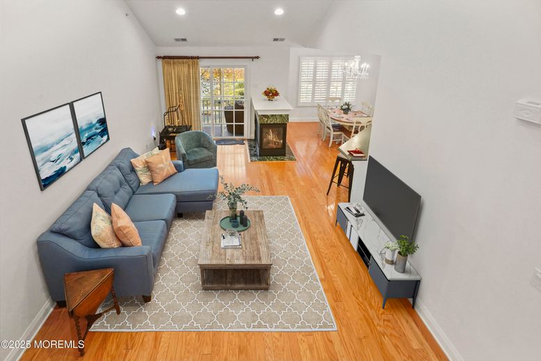 Dining room, Fireplace, Interior, Living room, Recessed Lighting, Wood Texture Flooring