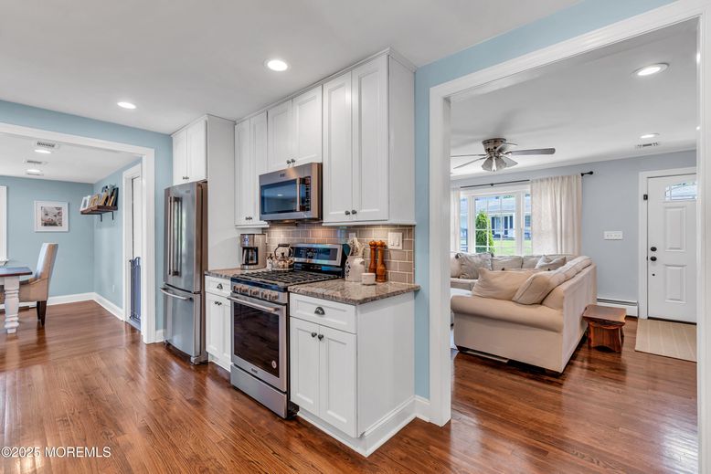 Dining room, Interior, Kitchen, Living room, Recessed Lighting, Stainless Steel Appliances, Wood Texture Flooring