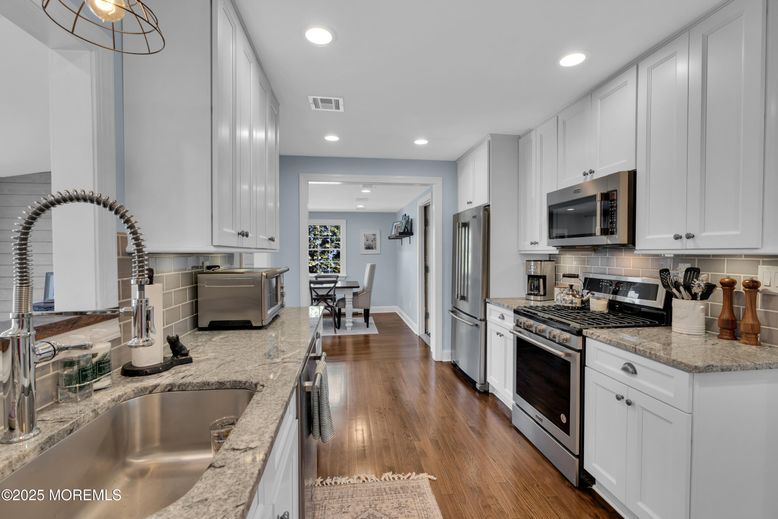 Dining room, Interior, Kitchen, Recessed Lighting, Stainless Steel Appliances, Wood Texture Flooring