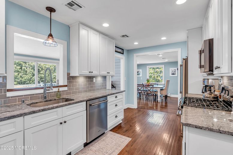 Dining room, Interior, Kitchen, Pendant Lights, Recessed Lighting, Stainless Steel Appliances, Wood Texture Flooring
