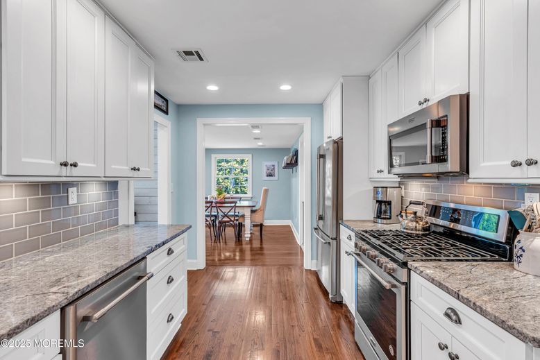 Dining room, Interior, Kitchen, Recessed Lighting, Stainless Steel Appliances, Wood Texture Flooring
