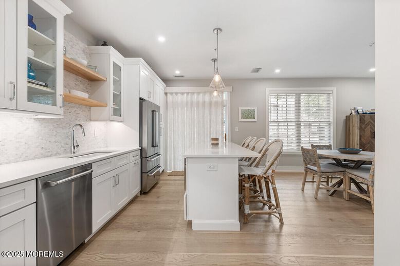Dining room, Interior, Kitchen, Pendant Lights, Recessed Lighting, Stainless Steel Appliances, Wood Texture Flooring