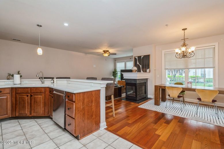 Chandelier, Dining room, Fireplace, Interior, Kitchen, Pendant Lights, Recessed Lighting, Wood Texture Flooring