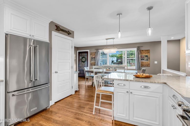 Chandelier, Dining room, Interior, Kitchen, Pendant Lights, Recessed Lighting, Stainless Steel Appliances, Wood Texture Flooring