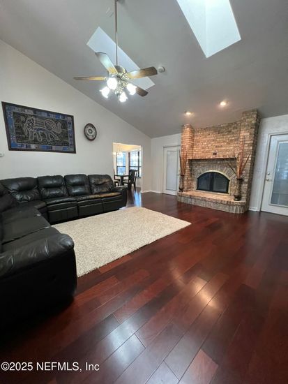 Fireplace, Interior, Living room, Recessed Lighting, Stone Walls, Wood Texture Flooring