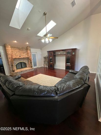 Fireplace, Interior, Living room, Recessed Lighting, Stone Walls, Wood Texture Flooring