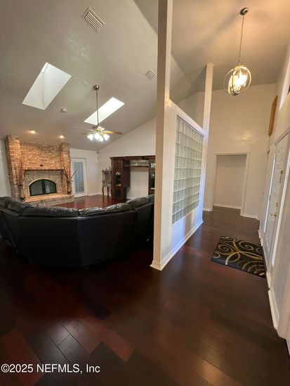 Fireplace, Interior, Living room, Pendant Lights, Recessed Lighting, Stone Walls, Wood Texture Flooring