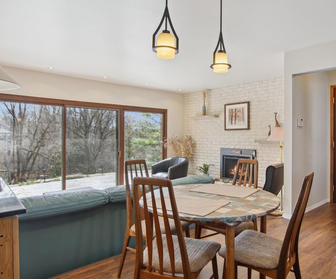 Dining room, Fireplace, Interior, Pendant Lights, Recessed Lighting, Stone Walls, Wood Texture Flooring