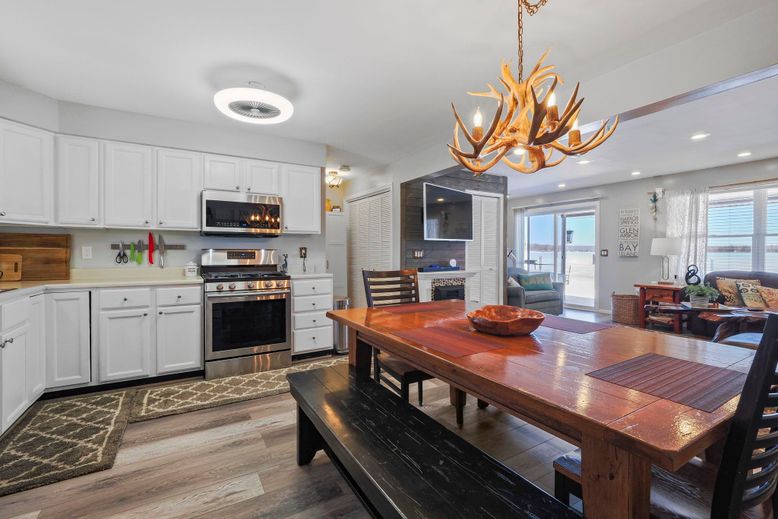 Chandelier, Dining room, Interior, Kitchen, Recessed Lighting, Stainless Steel Appliances, Wood Texture Flooring