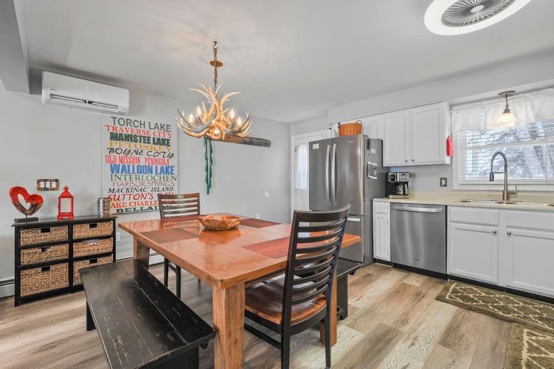 Chandelier, Dining room, Interior, Kitchen, Pendant Lights, Stainless Steel Appliances, Wood Texture Flooring