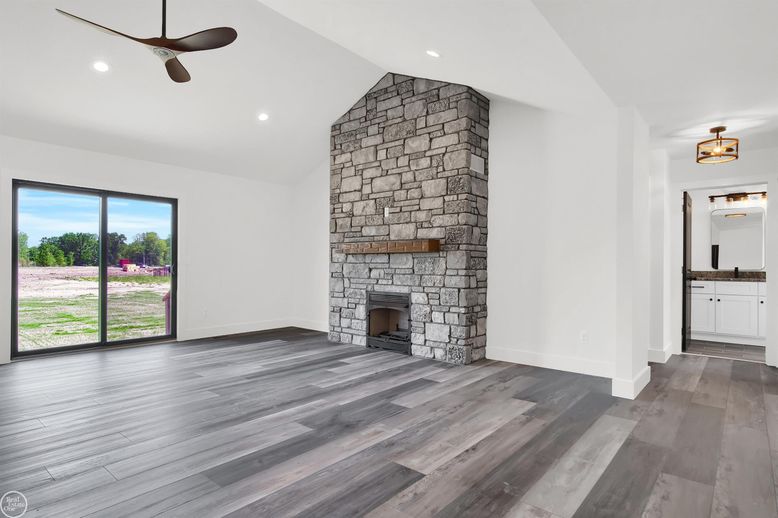 Empty room, Fireplace, Interior, Recessed Lighting, Stone Walls, Wood Texture Flooring