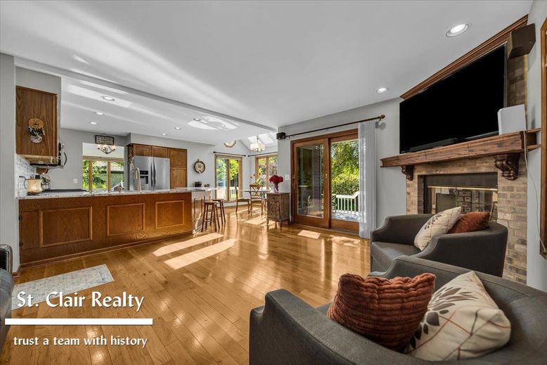 Dining room, Fireplace, Interior, Kitchen, Living room, Recessed Lighting, Stainless Steel Appliances, Wood Texture Flooring