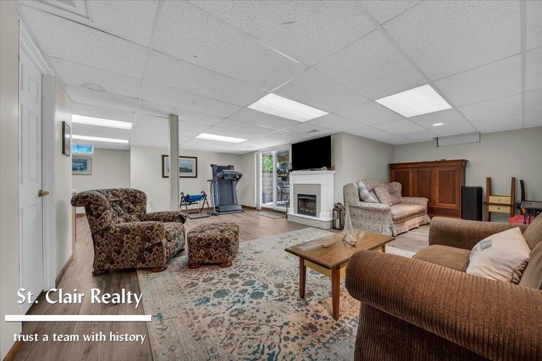 Fireplace, Fitness Equipment, Interior, Living room, Recessed Lighting, Wood Texture Flooring