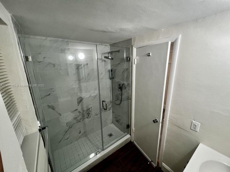 Bathroom, Glass Shower, Interior, Marble Walls, Wood Texture Flooring