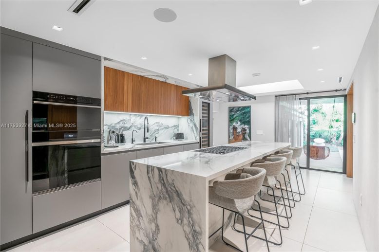 Interior, Kitchen, Marble Walls, Recessed Lighting, Stainless Steel Appliances