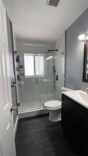 Bathroom, Glass Shower, Interior, Marble Walls, Wood Texture Flooring