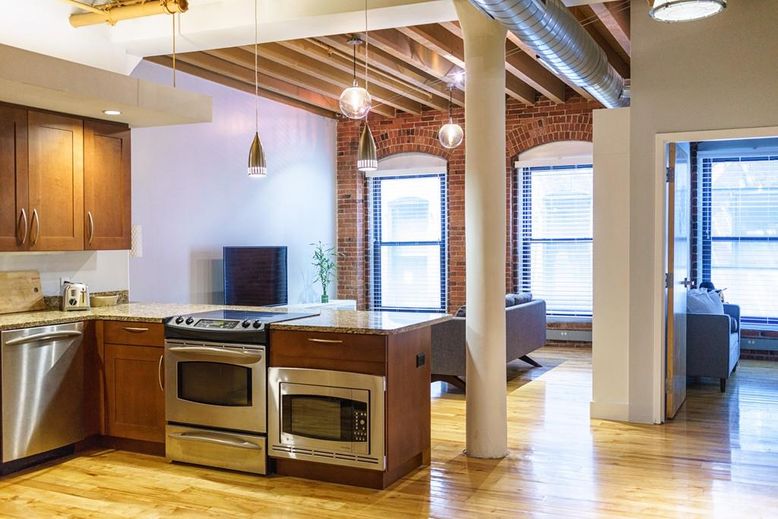 Interior, Kitchen, Pendant Lights, Stainless Steel Appliances, Stone Walls, Wood Texture Flooring