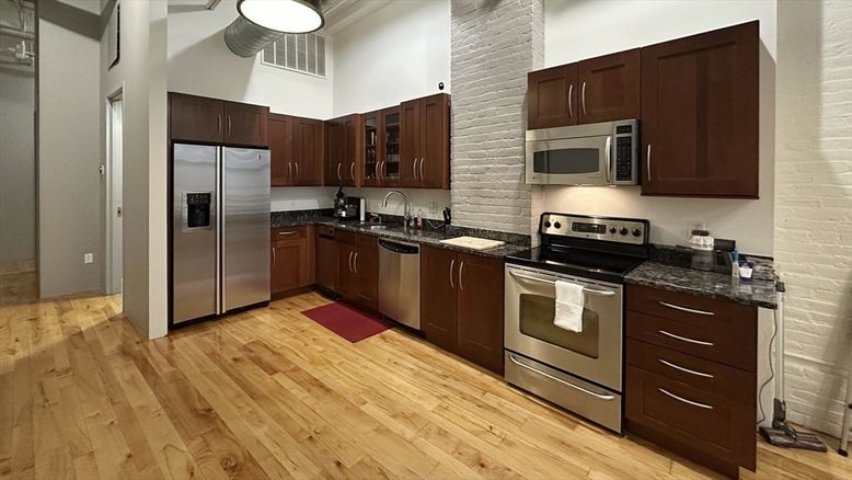 Interior, Kitchen, Pendant Lights, Stainless Steel Appliances, Stone Walls, Wood Texture Flooring
