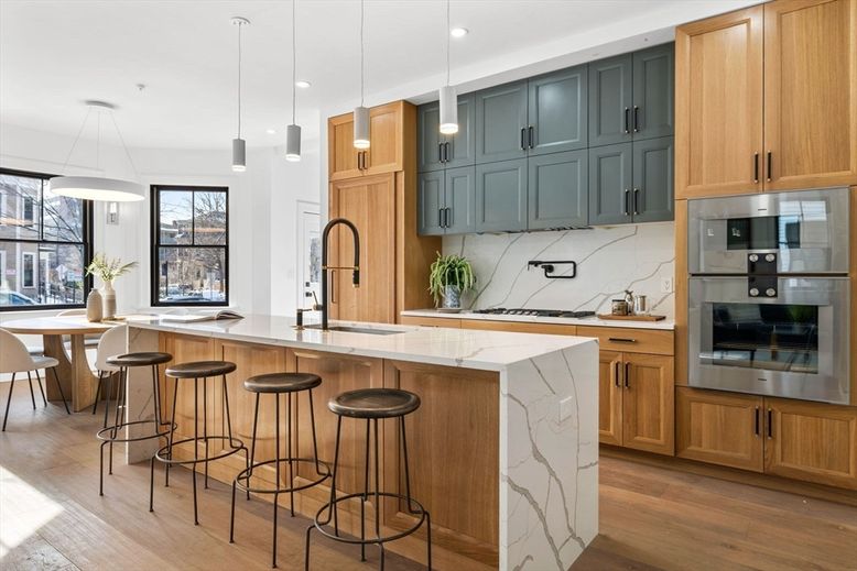 Interior, Kitchen, Marble Walls, Pendant Lights, Recessed Lighting, Stainless Steel Appliances, Wood Texture Flooring